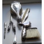 A pair of silver hafted glove stretchers; a silver hafted powder brush; silver pill box; silver