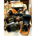 A Coronet bellows camera; a Kowa SE 35mm SLR camera, 50mm lens, flash adapters, light meter etc