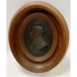 An early 20th century relief bronzed metal portrait plaque inscribed Amaut, 18cm x 13cm, framed