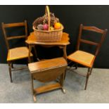 An Edwardian mahogany occasional table; an oak dropleaf occasional table, two cane seated side