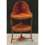 A Regency mahogany corner washstand, shaped back, shaped apron, single drawer flanked by faux