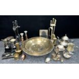 Metalware - a large silver plated tripod footed alms dish; teapot; brass companion set on stand,