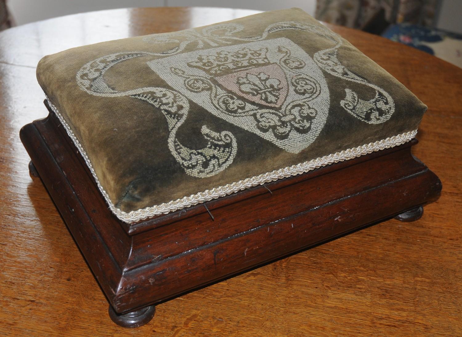 A Victorian foot stool, the velvet top with crest, ogee sides, bun feet, 32cm wide, 25cm deep, c. - Image 2 of 2