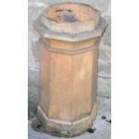 A hexagonal terracotta chimney pot, 68cm high