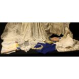 Textiles - a wedding tiara and veil, early 1954; a pair of 1950s gentleman's swimming trunks; a