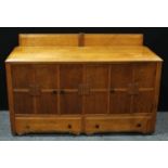 A 20th century oak kitchen sideboard, bevelled half gallery above a rectangular top, three