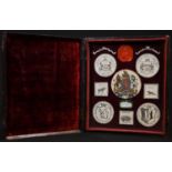 Heraldry - a collection of clipped-paper watercolour armorials and seal impressions, mounted for the