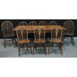 A mid 20th century oak dining table, ractangular top, turned legs, bun feet, 200cm wide, 78cm