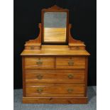 A Late Victorian walnut dressing table, rectangular mirrored back flanked by two small drawers,