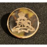 A 9ct gold and tortoiseshell Royal Artillery brooch, hallmarked