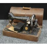 A singer hand cranked sewing machine, cased