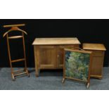 A 20th century pine side cabinet, rectangular top above a pair of cupboard doors enclosing a