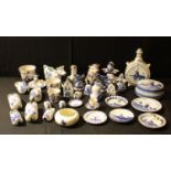 A Delft blue and white moon flask, clogs, windmill, figures, plates; other decorative ceramics; qty