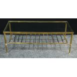A 20th century brass coffee table, rectangular glass top, fluted legs, 41cm high, 111cm wide.