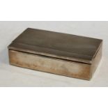A silver rectangular cigarette box, engine turned, pop-up mechanism, Chester 1931, 15.5cm wide