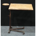 An early-mid 20th century cast iron framed bedside serving trolley, in the form of an 'architect'