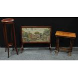 An early 20th century mahogany firescreen, c.1920; a mahogany nest of tables; an Edwardian