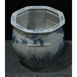 A large Chinese export octagonal jardiniere, painted in blue on a crackle ground, decorated with