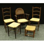 A wicker armchair; a pair of rush seat kitchen chairs; a rush seat stool; another (5)