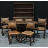 An oak dining room suite, rectangular refectory table, 152.5cm x 7.5cm six studded leather padded