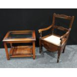 An early 20th century commode armchair, with ceramic pot and cover; a glass top coffee table (2)