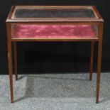 An 'Edwardian' style mahogany rectangular bijouterie cabinet, hinged top, tapered square legs, 74.
