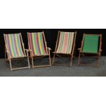 1970s and late wooden and canvas folding deck chairs. (4)