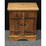 A small rustic style hardwood cupboard, rectangular top above a pair of cupboard doors enclosing