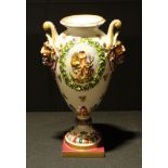 A Continental porcelain ovoid pedestal vase, 31cm high