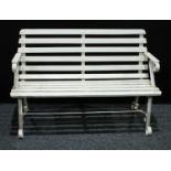 A late 20th century painted garden bench, wrought iron arms and strecher, wooden slats,120.5cm wide,