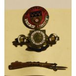 A Derbyshire Air Raid Welfare enamel badge; an Army Service Corps enamel badge; a YSER rifle and