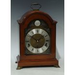 An Elliott mahogany bracket clock, 8-Day lever Westminster and Whittington chime, arched case, brass