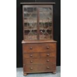 A 19th century mahogany secretaire bookcase, astragal glazed upper section, fitted drawer, bun