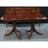 A reproduction Regency style twin pedestal mahogany dining table, rounded rectangular top, reeded