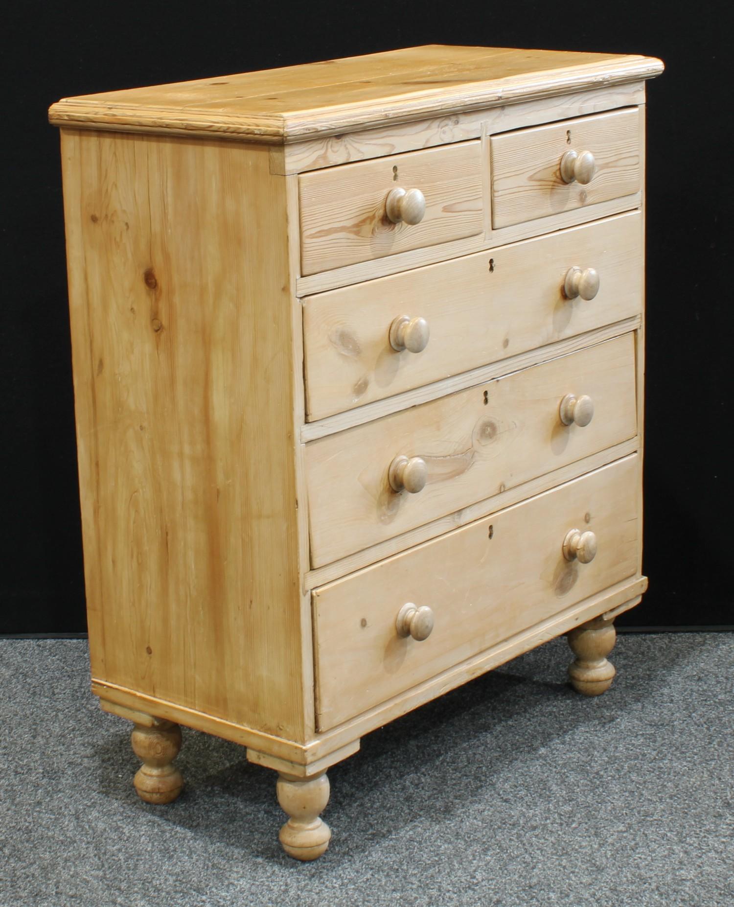 A farmhouse pine chest of drawers, oversailing rectangular top above two short and three long - Image 3 of 3