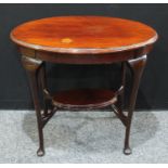 A Victorian mahogany oval centre table, oversailing top above a deep frieze, oval undertier,