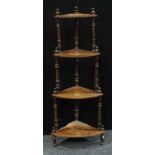 A Victorian mahogany four tier corner whatnot, graduated shelves, turned supports, 136cm high.