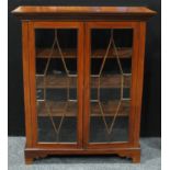 A George III revival mahogany display cabinet, greek key cornice above a pair of astro-glazed