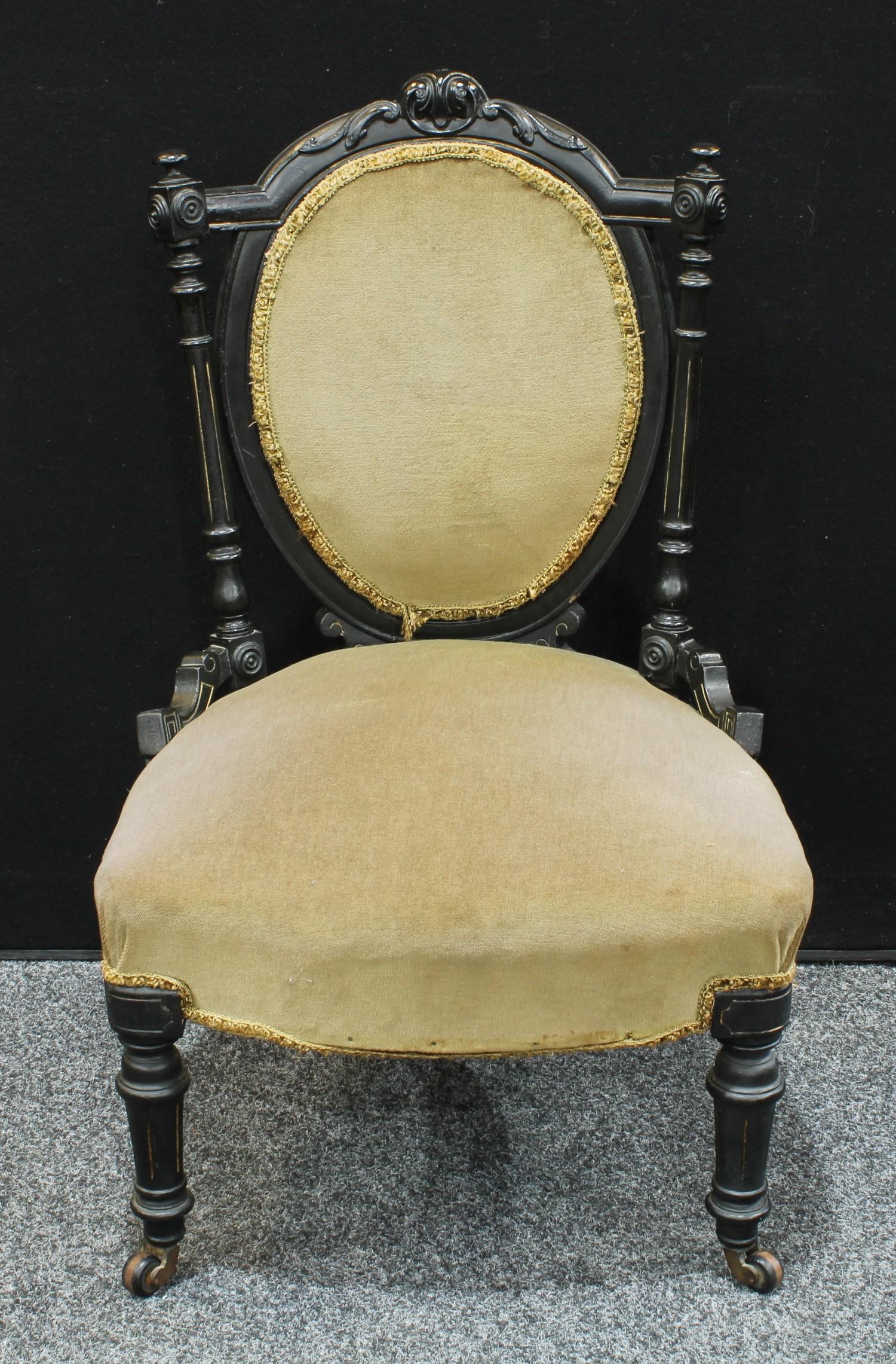 An Aesthetic Movement ebonsied low salon chair, stuffed-over oval back crested by scrolling - Image 3 of 4