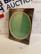 Brand New Twins Quartz Oval Design Wall Clock