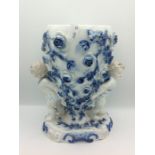 Decorative blue and white cherub vase 25cm tall