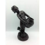 Bronze figure of child carrying water, 25cm