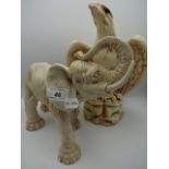 2 coated plaster ornaments of eagle (30cm tall) and elephant (28cm long)