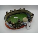 An oval oriental ceramic shallow bowl surround by figures. 15 x 20cm