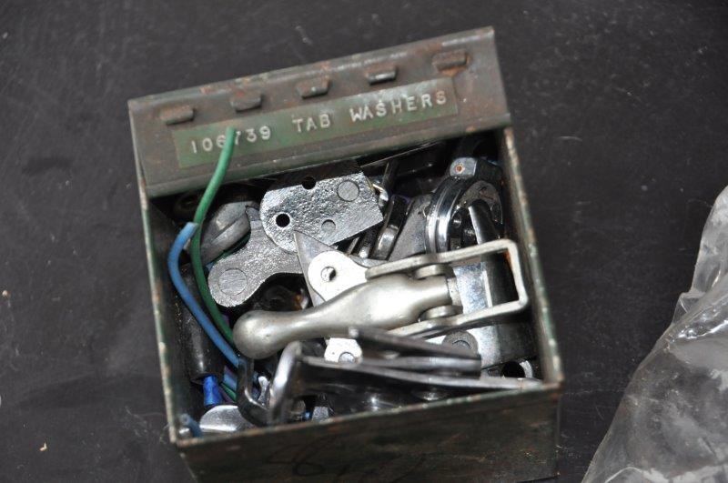 Box of vintage chromed bodywork fittings