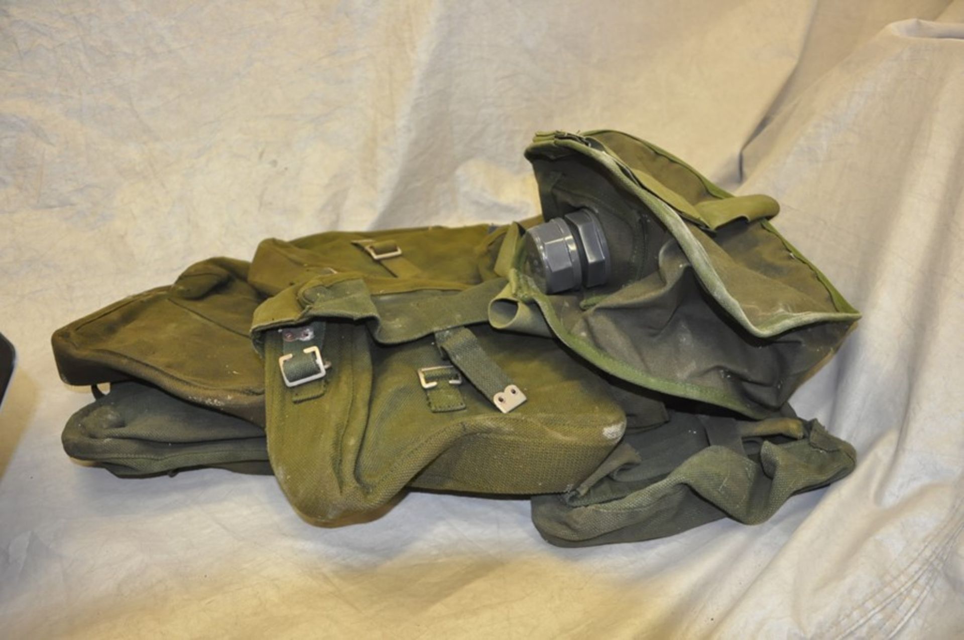 Six 1950's webbing packs and 1990 water carrier