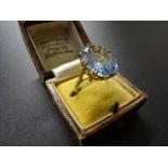9K gold ring in box with large Aqua marine coloured stone