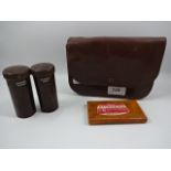 Vintage travelling male vanity set in leather wallet containing to Bakelite shaving pots and brush