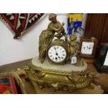 An ornate mantle clock marked AMC and AC