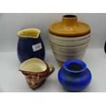 4 pieces to include Royal Doulton toby jug, Bretby vase, Denby 1pt jug and German vase 4019